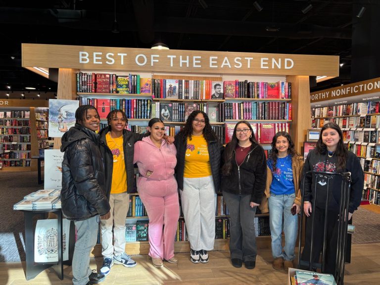 BEP youth pose together at a Best of the East End bookstore display